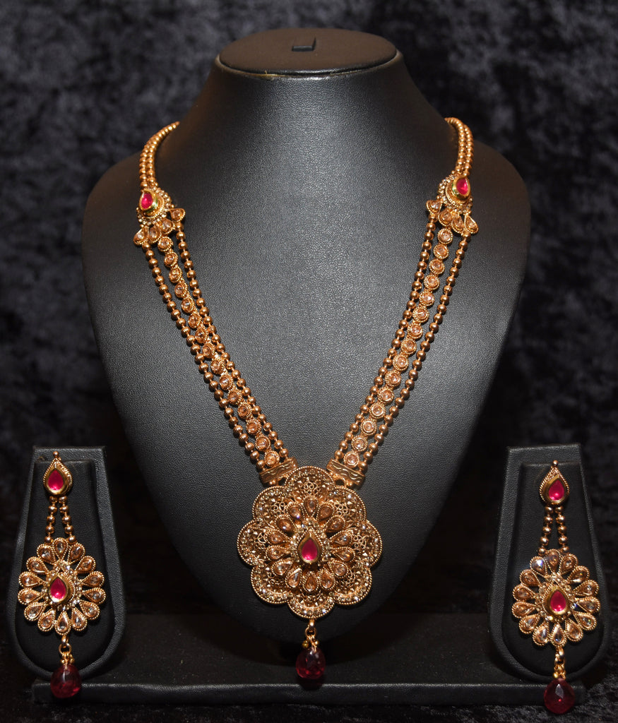 Long gold plated set with ruby drop